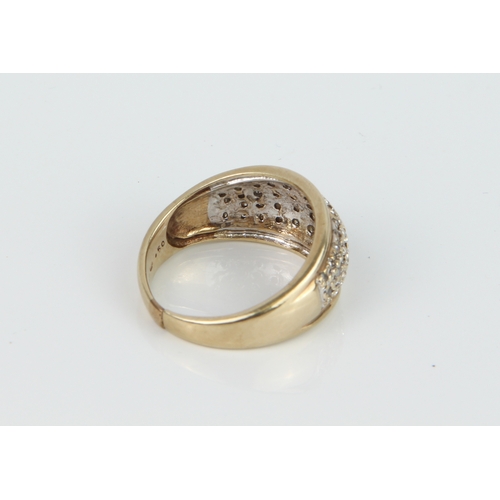 231 - A 9ct yellow and gold and diamond ring - hallmarked 9K 375, the domed ring pavé set with small singl... 