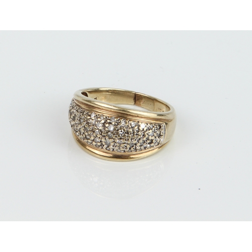 231 - A 9ct yellow and gold and diamond ring - hallmarked 9K 375, the domed ring pavé set with small singl... 