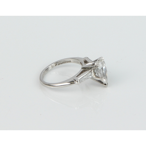 242 - A fine platinum and diamond single stone ring - marked '10XIRIDPLAT K', the pear cut diamond, approx... 