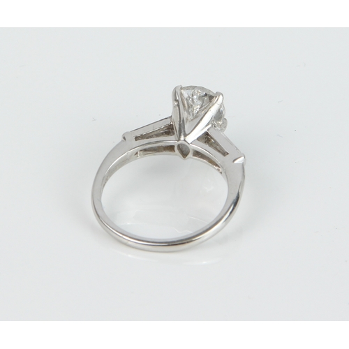 242 - A fine platinum and diamond single stone ring - marked '10XIRIDPLAT K', the pear cut diamond, approx... 