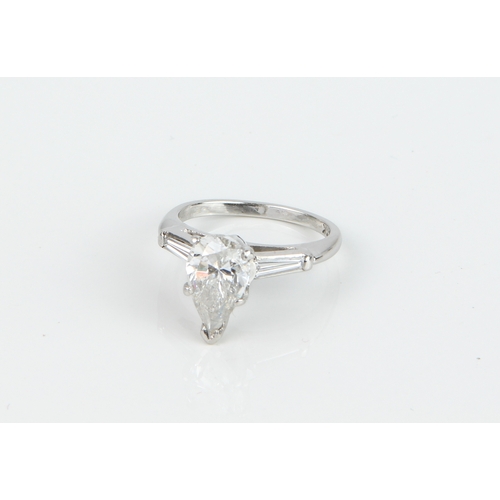 242 - A fine platinum and diamond single stone ring - marked '10XIRIDPLAT K', the pear cut diamond, approx... 