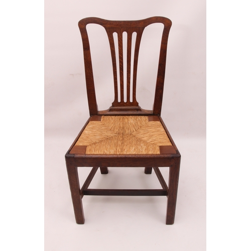 441 - A set of three early 19th century provincial oak chairs - the yoke backs with pierced vase splats ov... 