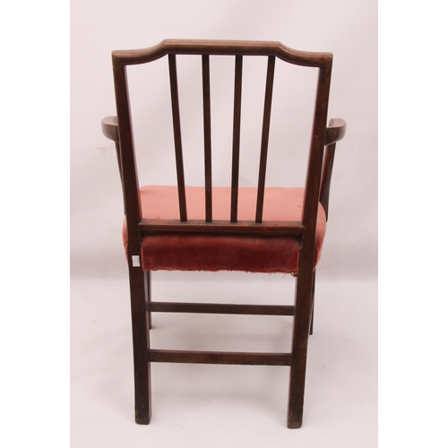 442 - A Regency mahogany elbow chair in the Hepplewhite style - the label top rail over a bar back with ce... 