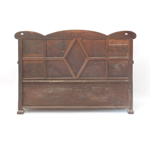 446 - A carved oak settle in the early 18th century style - early 20th century, the shaped, panelled back ... 