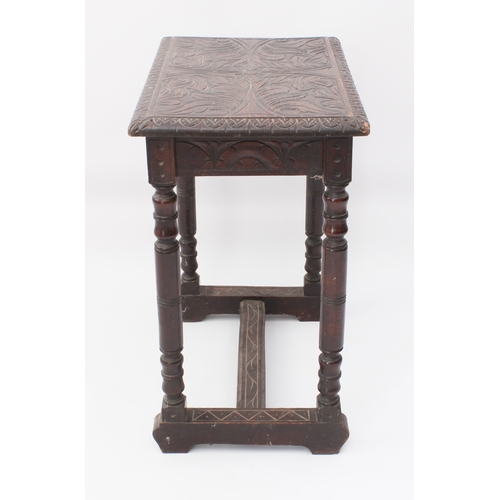 454 - A 19th century carved oak occasional table in the late-17th century style - the rectangular moulded ... 