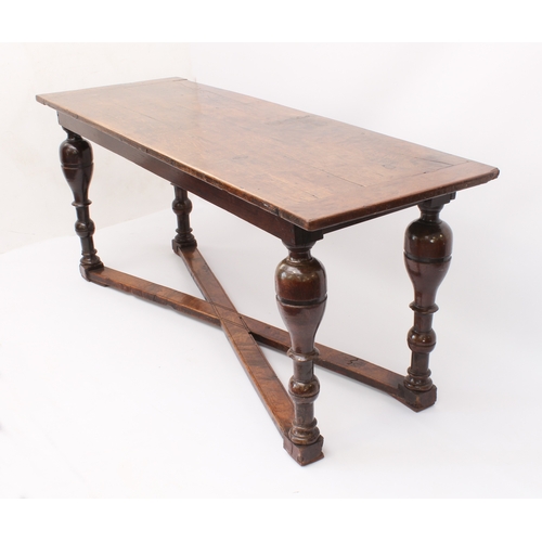 466 - A narrow oak refectory table in early 18th century style -  later constructed, using some earlier el... 