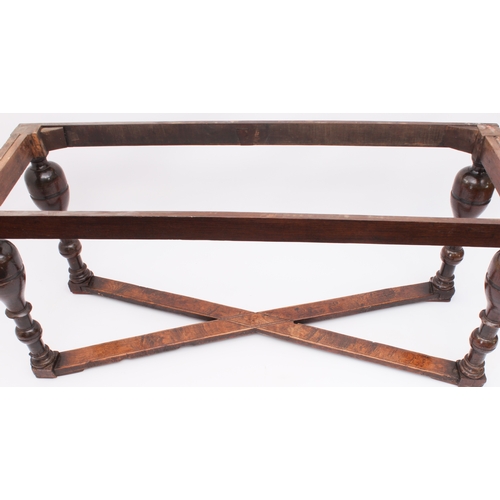 466 - A narrow oak refectory table in early 18th century style -  later constructed, using some earlier el... 