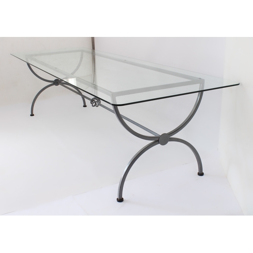 469 - A wrought iron and glass dining table of imposing proportions - modern, the rectangular glass top wi... 