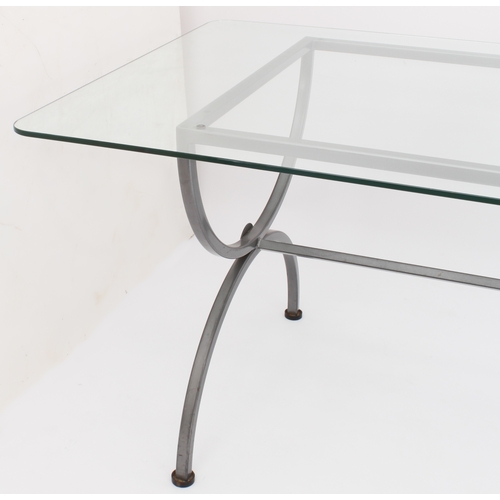 469 - A wrought iron and glass dining table of imposing proportions - modern, the rectangular glass top wi... 