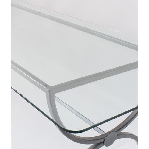 469 - A wrought iron and glass dining table of imposing proportions - modern, the rectangular glass top wi... 