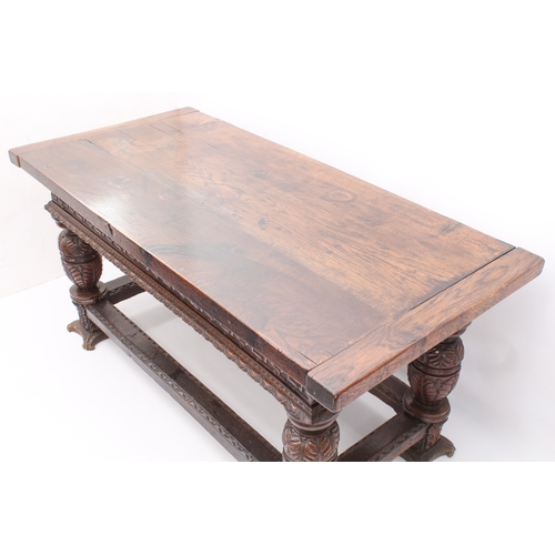 470 - An Elizabethan-style carved oak refectory table - 20th century, the three-plank, cleated top over a ... 