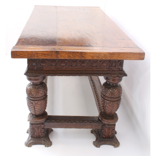 470 - An Elizabethan-style carved oak refectory table - 20th century, the three-plank, cleated top over a ... 