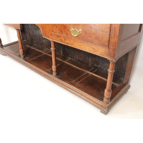 480 - A mid-18th century oak potboard dresser - the ogee cornice over a closed plate-rack with three shelv... 