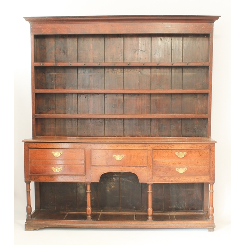 480 - A mid-18th century oak potboard dresser - the ogee cornice over a closed plate-rack with three shelv... 