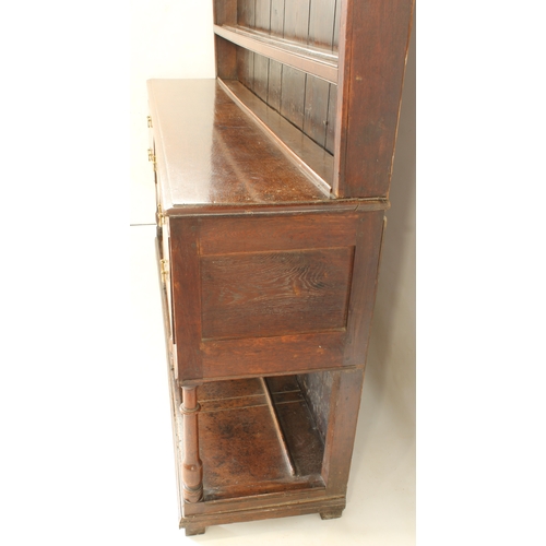 480 - A mid-18th century oak potboard dresser - the ogee cornice over a closed plate-rack with three shelv... 