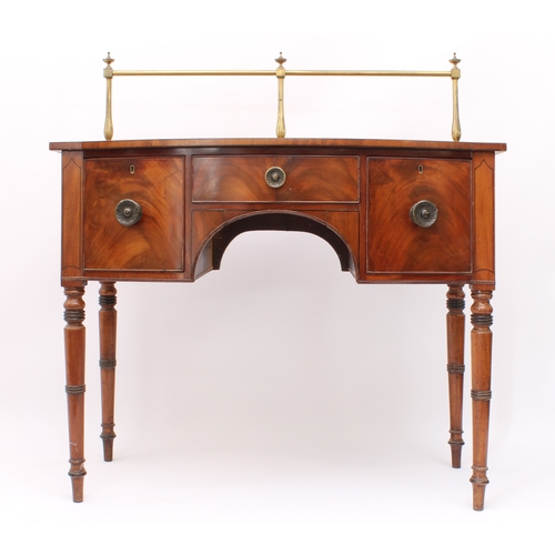 482 - A late-Regency mahogany bowfronted sideboard of small proportions - c.1825, with brass rail to back,... 