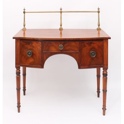 482 - A late-Regency mahogany bowfronted sideboard of small proportions - c.1825, with brass rail to back,... 