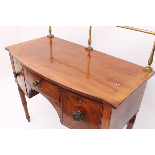 482 - A late-Regency mahogany bowfronted sideboard of small proportions - c.1825, with brass rail to back,... 