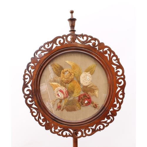 485 - A William IV rosewood pole screen - the circular fretwork screen with a silk, wool and bead embroide... 