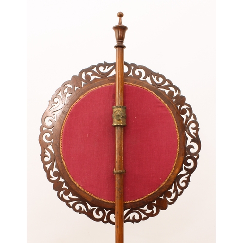 485 - A William IV rosewood pole screen - the circular fretwork screen with a silk, wool and bead embroide... 