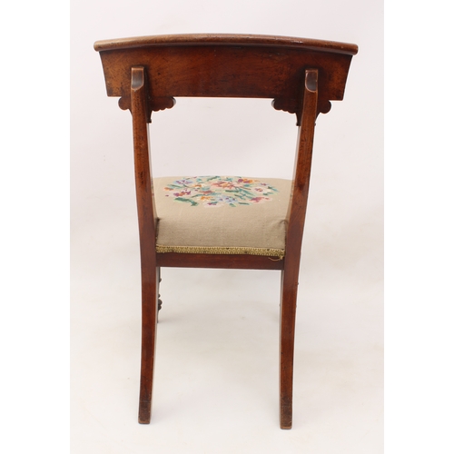 486 - A set of four William IV walnut dining chairs - the scrolled, curved top rails on foliate carved sab... 