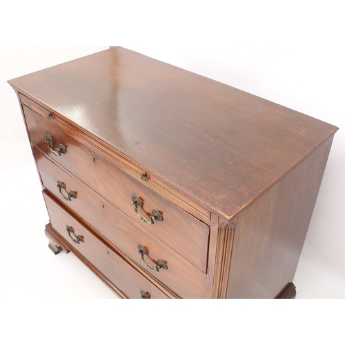 487 - A George III mahogany straight-front chest of drawers - the moulded top with brushing slide, over th... 