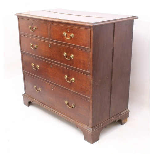 488 - A George III oak straight front chest of drawers - the ogee moulded top over two short and three lon... 