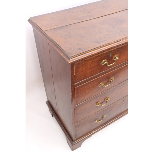 488 - A George III oak straight front chest of drawers - the ogee moulded top over two short and three lon... 