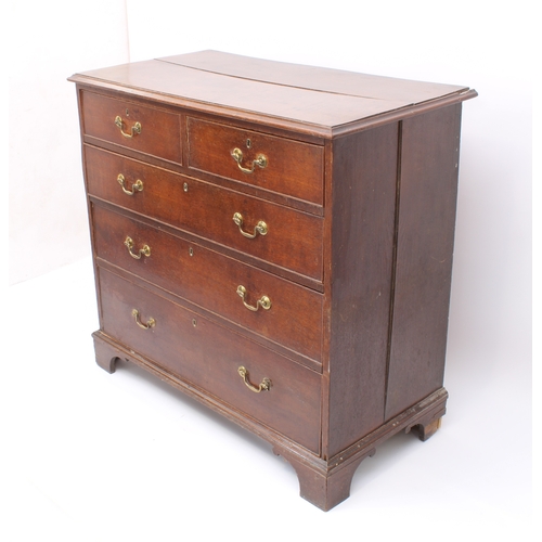 488 - A George III oak straight front chest of drawers - the ogee moulded top over two short and three lon... 