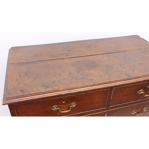 488 - A George III oak straight front chest of drawers - the ogee moulded top over two short and three lon... 