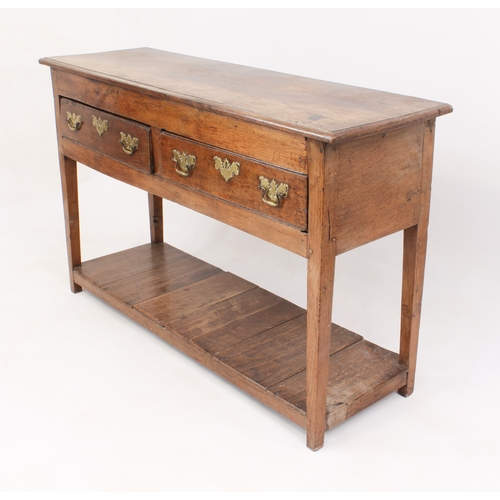 499 - An early 18th century oak potboard dresser of small proportions - the moulded top over two drawers w... 