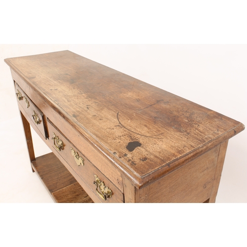 499 - An early 18th century oak potboard dresser of small proportions - the moulded top over two drawers w... 