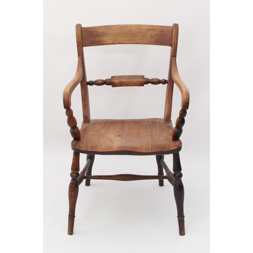 500 - A mid-19th century beech and elm elbow chair - the curved top rail over a turned label rail, above s... 