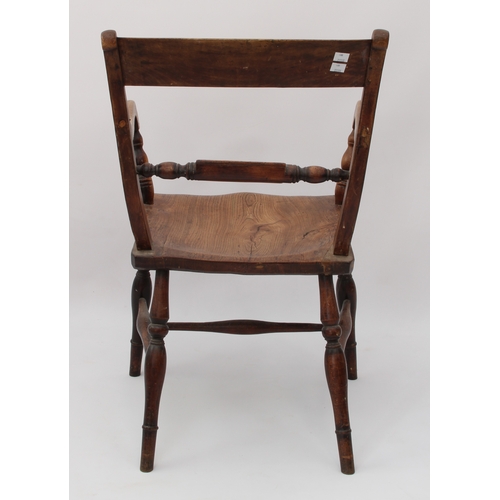 500 - A mid-19th century beech and elm elbow chair - the curved top rail over a turned label rail, above s... 