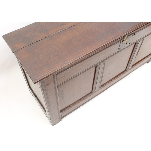 502 - A late 17th century boarded oak chest - of generous proportions, the two-plank top with chip carved ... 