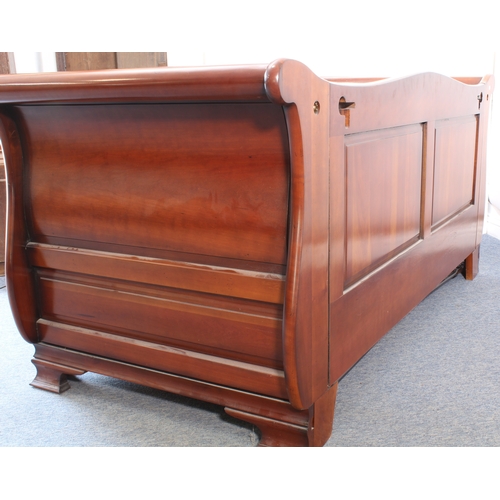 504 - A cherrywood sleigh-style double sofa-bed by And So To Bed - with a panelled back, panelled scroll a... 