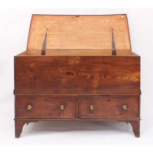 509 - A George III elm two-part mule chest - the moulded, cleated top on iron strap hinges, raised on a tw... 