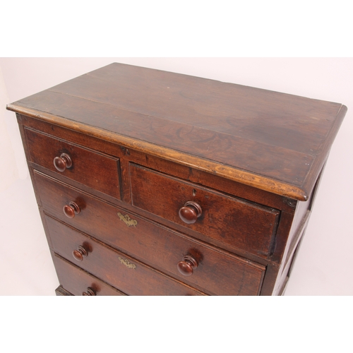 510 - An 18th century oak chest of drawers - the boarded oak top with later edge moulding, over three-pane... 