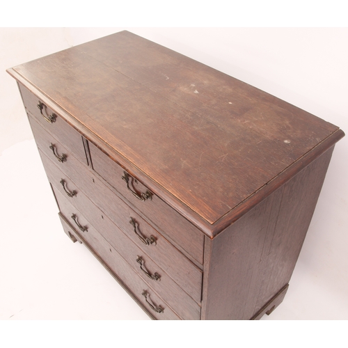 522 - A George III provincial oak straight-front chest of drawers - the moulded top over two short and thr... 