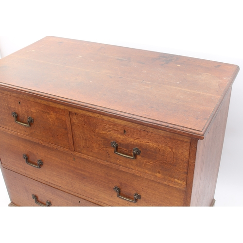 524 - A Victorian oak chest of drawers - the moulded top over two short and two long graduated drawers wit... 