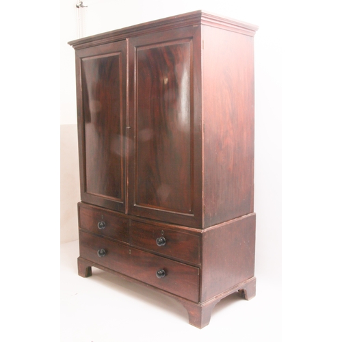 526 - An early to mid-19th century mahogany linen press - the moulded cornice over a pair of chamfered pan... 