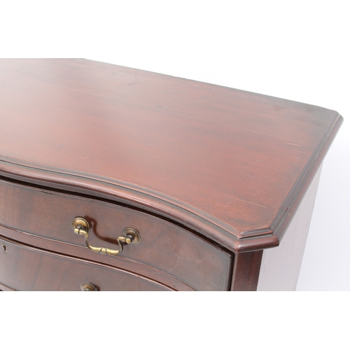 527 - A George III style serpentine mahogany chest of drawers - first half 20th century, the moulded top o... 