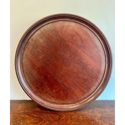 530 - A Georgian-style mahogany Lazy Susan - mid-20th century, the dished top on a turned swivel base with... 