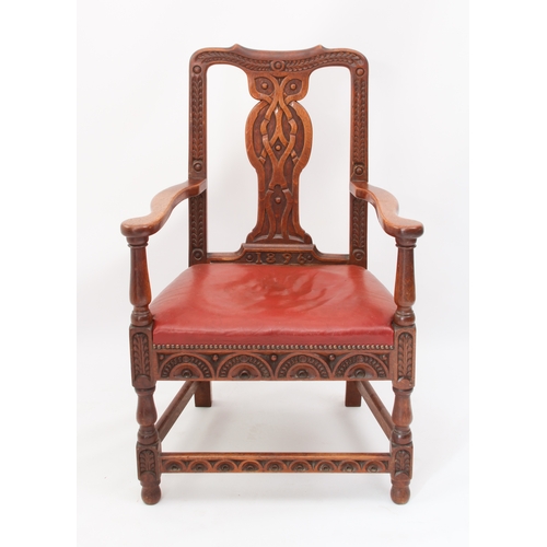 531 - A late 19th century carved oak open armchair - the shaped top rail and uprights carved with fern lea... 