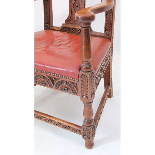 531 - A late 19th century carved oak open armchair - the shaped top rail and uprights carved with fern lea... 