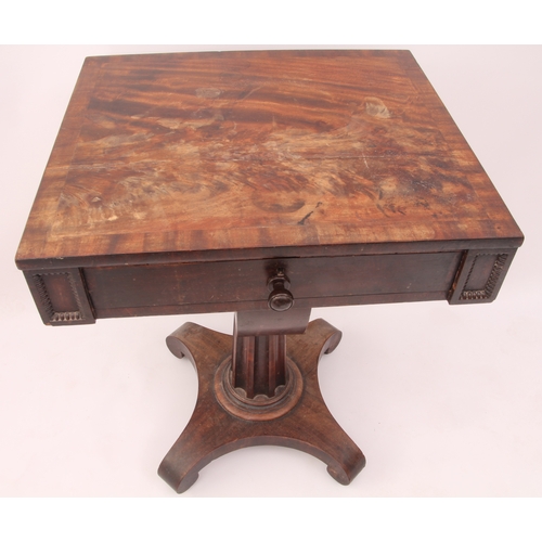 535 - A William IV mahogany work table - the crossbanded rectangular top over a frieze drawer with reel mo... 