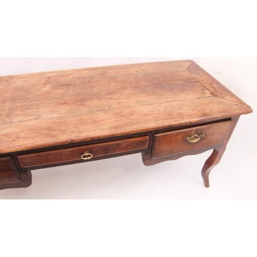 537 - A 19th century French chestnut and beech writing table - the cleated rectangular top over three draw... 