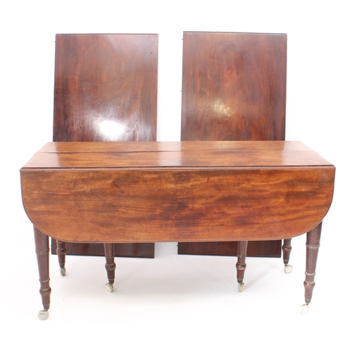 543 - A Regency mahogany dropflap extending dining table with concertina action - the rectangular dropflap... 