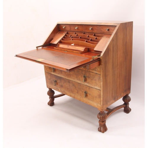 544 - A 1930s burr walnut bureau with mechanical interior mechanism - the quarter veneered fall opening to... 