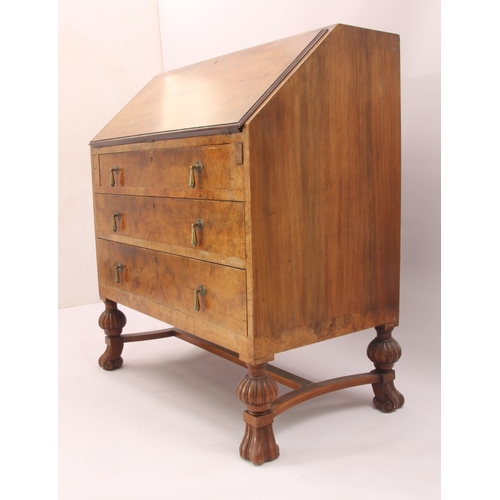 544 - A 1930s burr walnut bureau with mechanical interior mechanism - the quarter veneered fall opening to... 